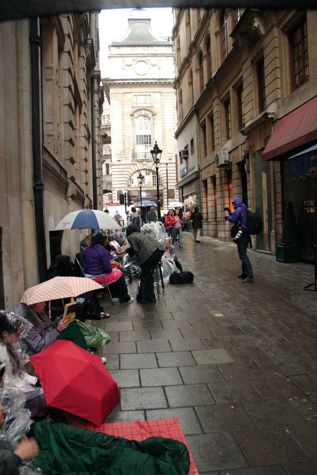 People queueing up for the Harry Potter book launch in London. See now comes the rain!