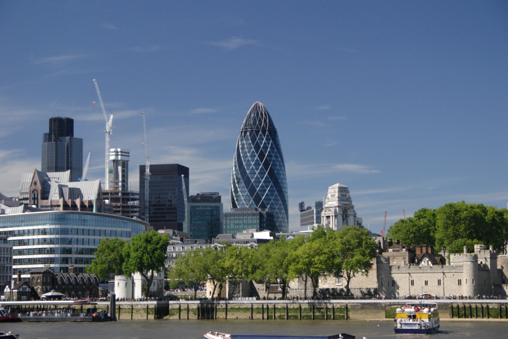 Swiss Re Tower - aka the Gherkin from next to the London Assembly Building, Nat West Tower is on the left of the photo.