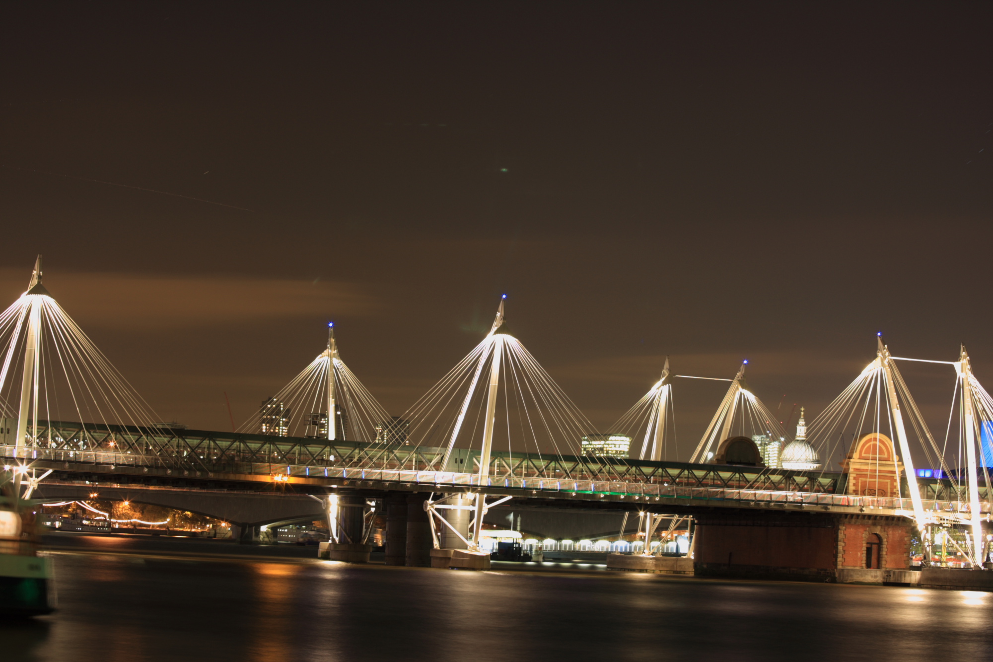 Bridges over the Thames at night.