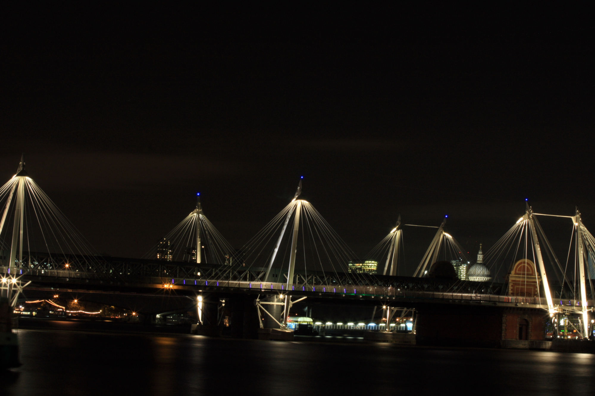 Bridges over the Thames at night.