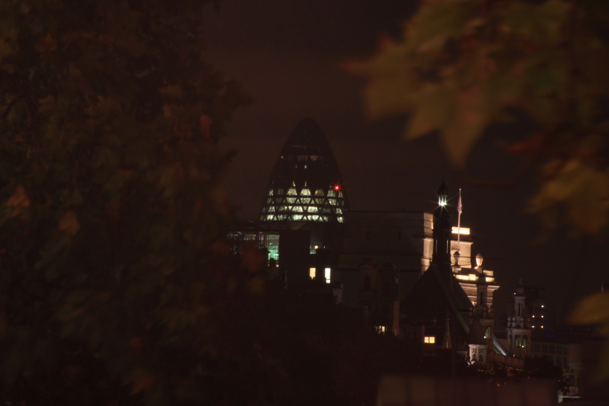 Swiss Re building at night.