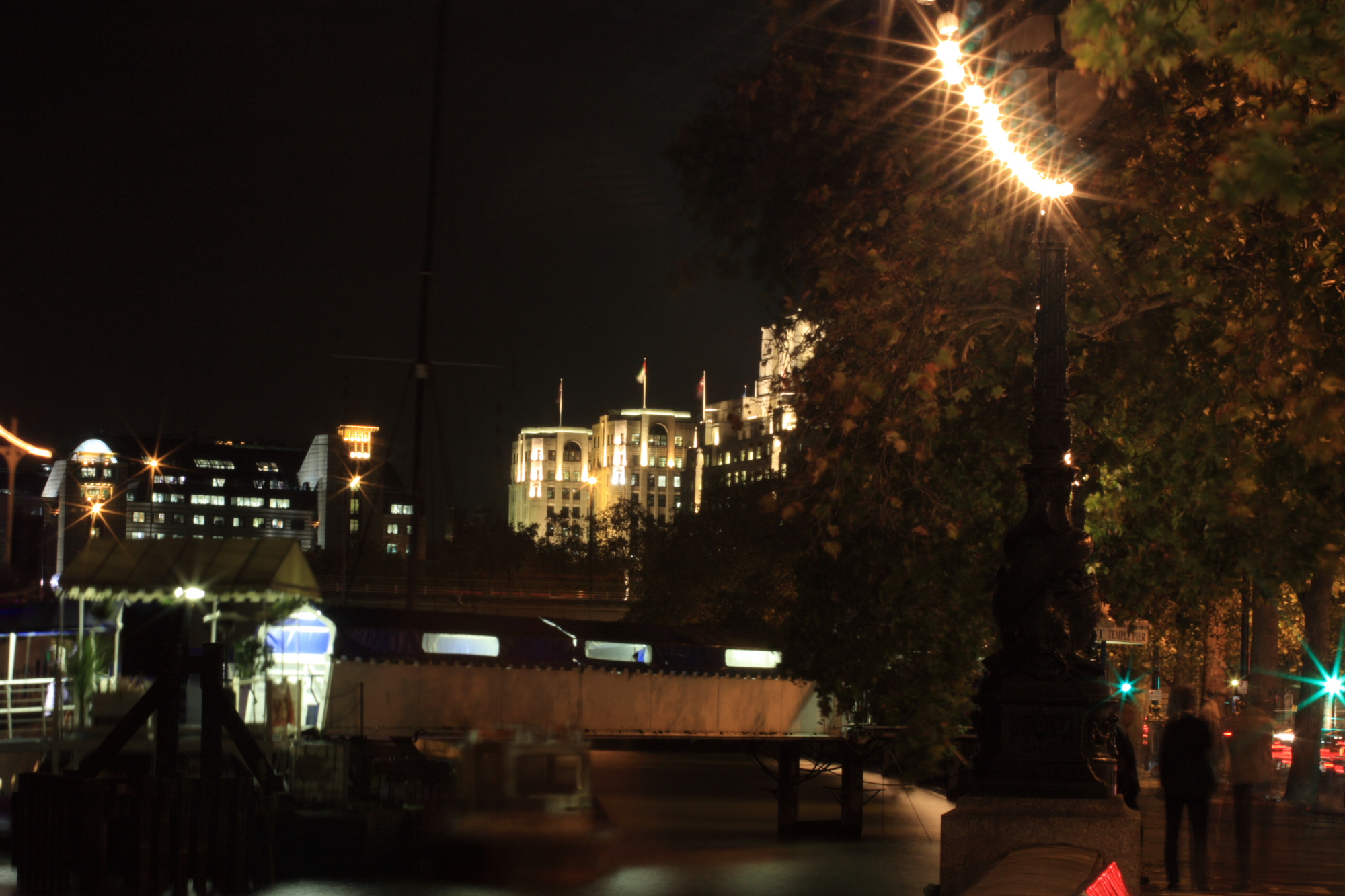 MoD buildings illuminated at night by the Thames